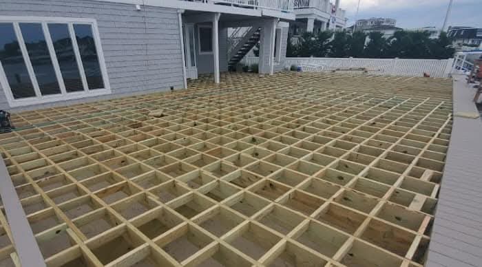 Treated timber pilings staged on barge